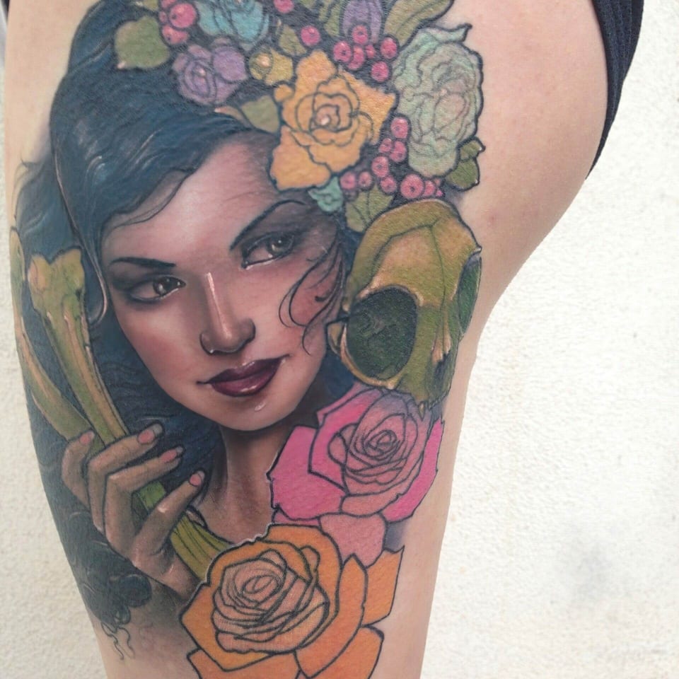 A color illustrative woman with dark hair appears among a flower crown, lilies and roses on the thigh.