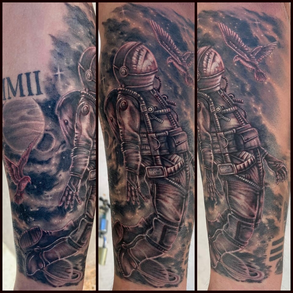 Black and grey realism astronaut with a bird and starry nebula covers the leg in several views.