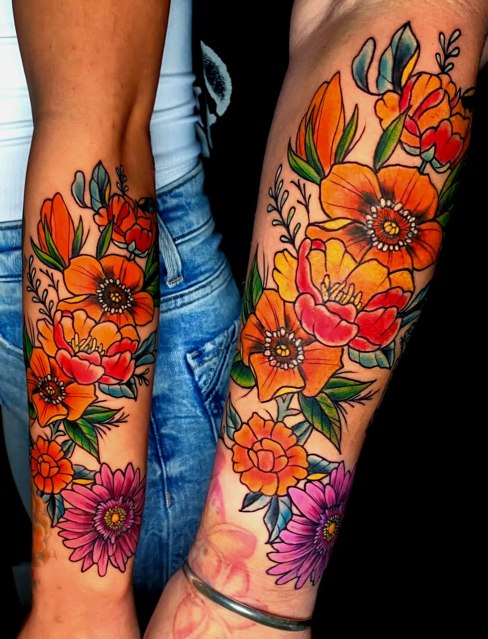 Orange and pink flowers with green leaves cover two forearm tattoos.