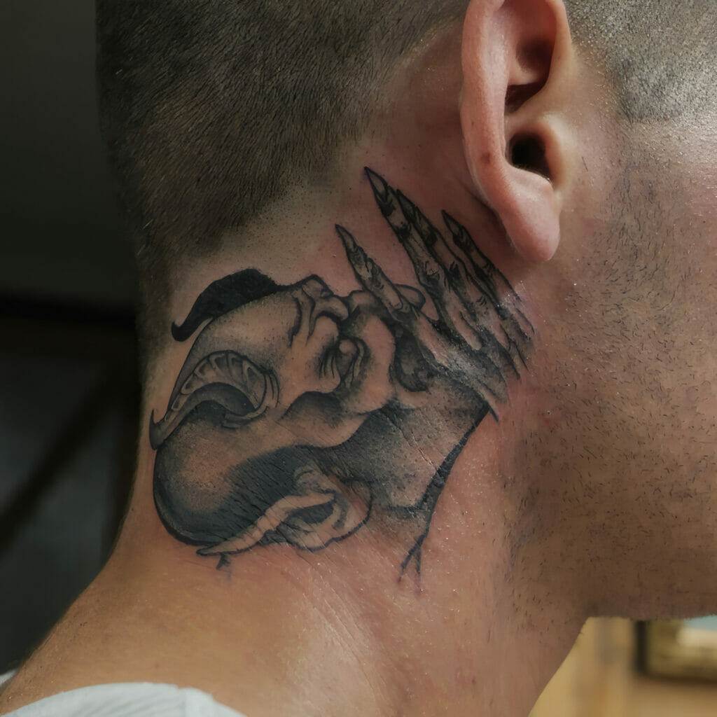 A man with a tattoo of a demon on his neck.