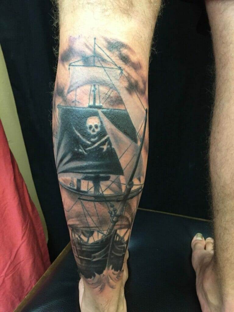 Pirate ship tattoo, man's leg.