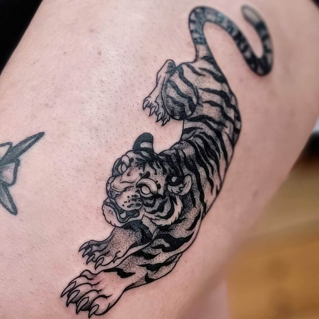 A tiger tattoo on a woman's thigh.