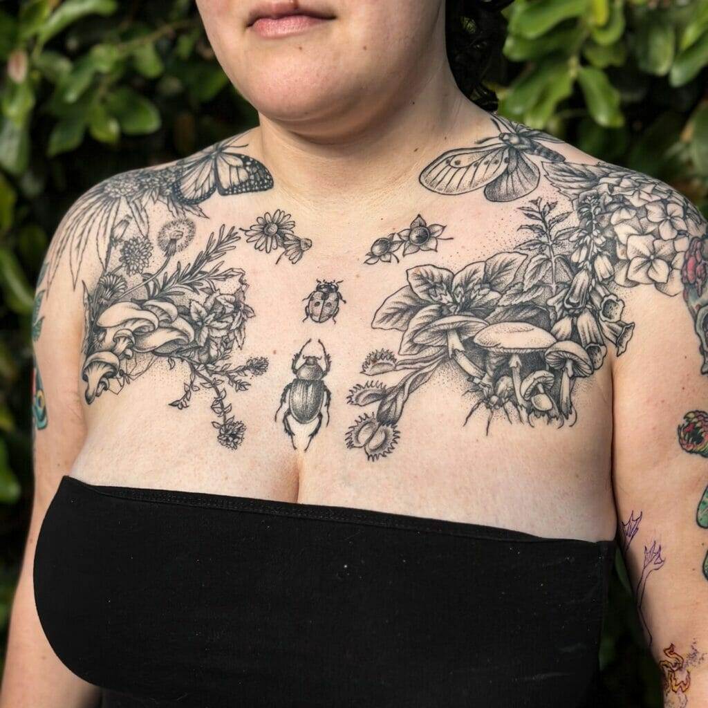 A woman with tattoos on her chest.