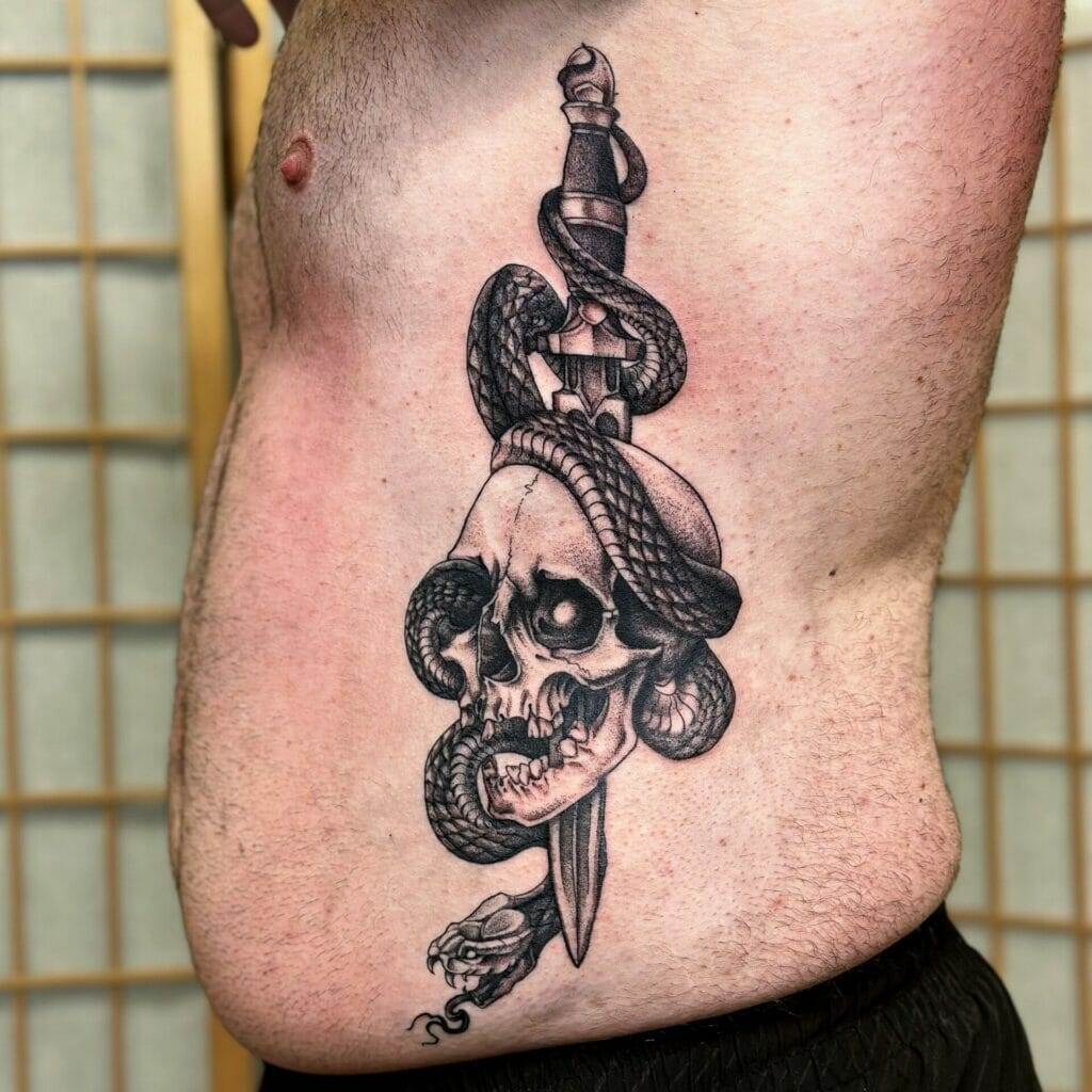 A man with a tattoo of a skull and a sword.