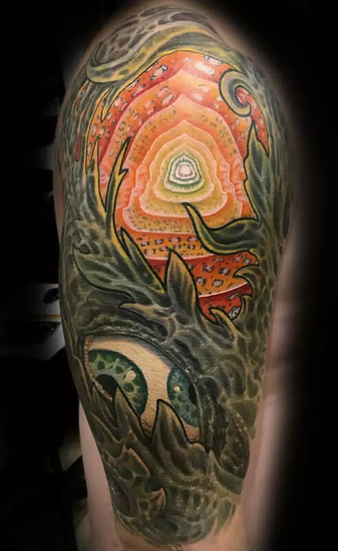 A man with a colorful tattoo on his arm.