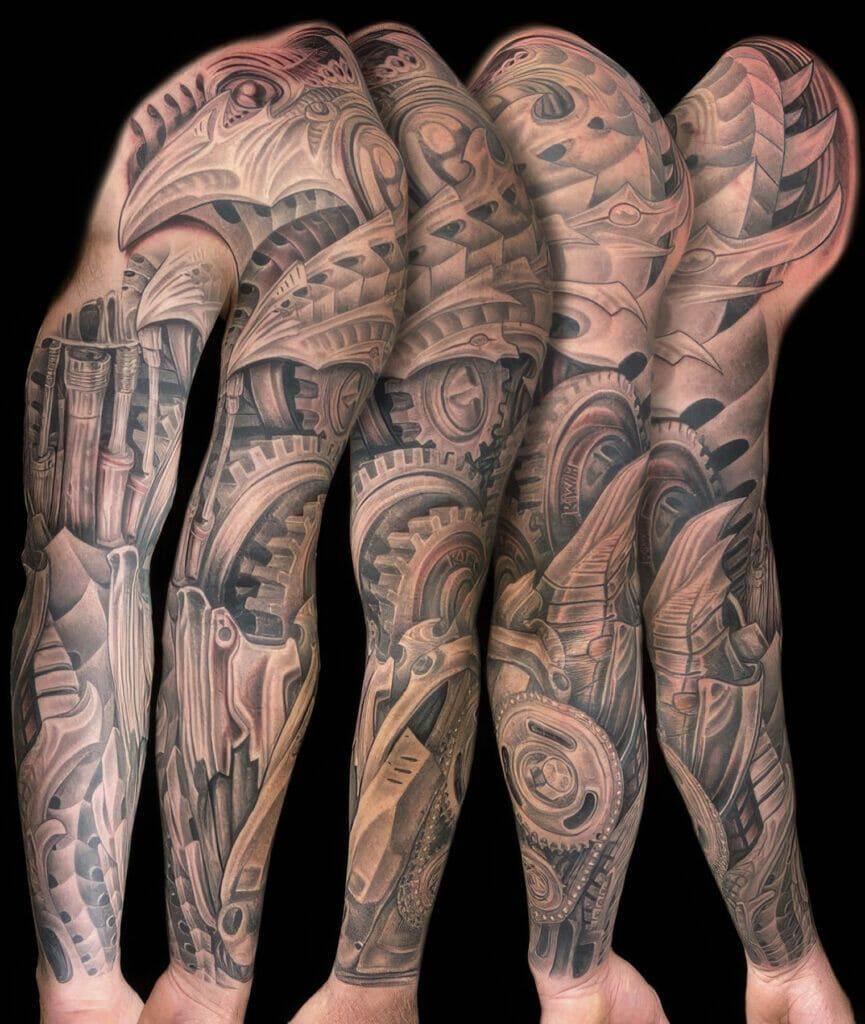 A man's sleeve tattooed with gears and gears.