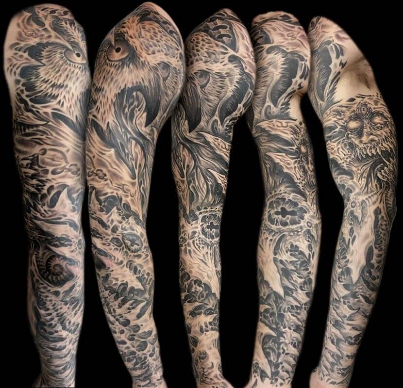 Black and grey sleeve tattoos.