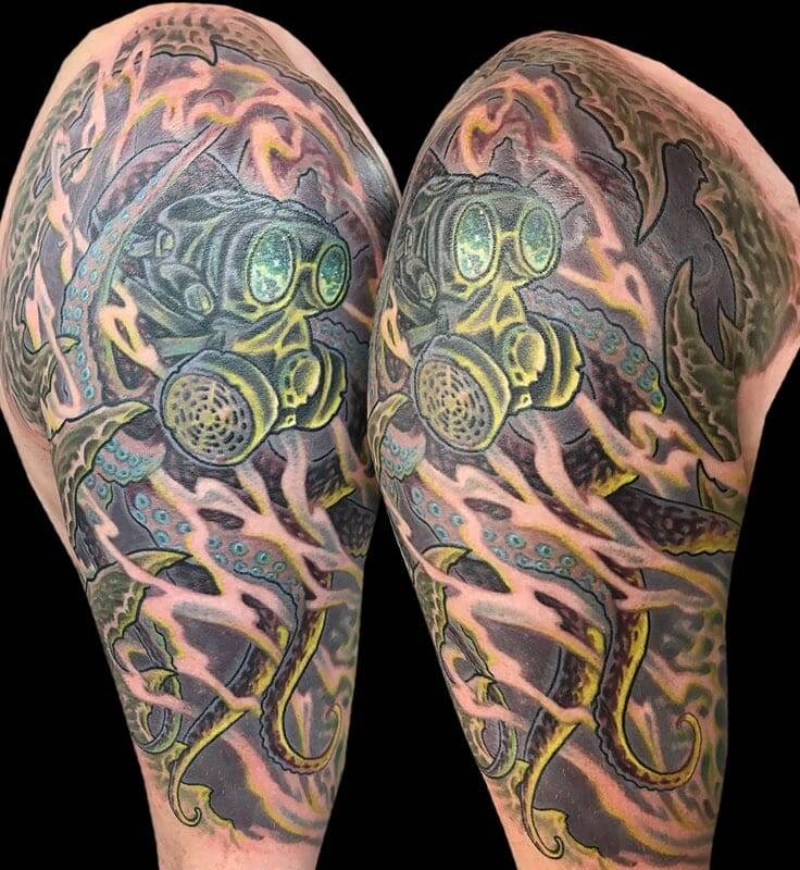 A tattoo of a man with a gas mask on his sleeve.