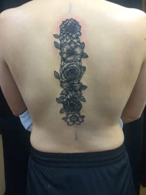 back, woman, black and white flower tattoo