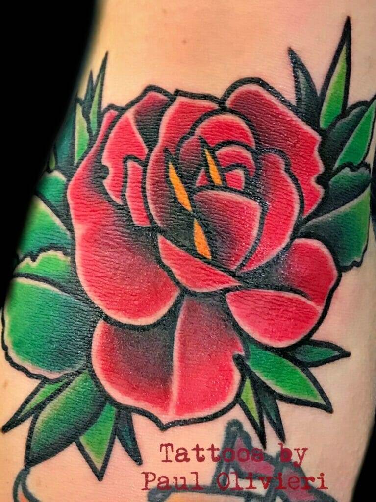 Red rose tattoo by paul hart.