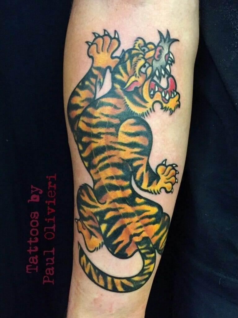 A tattoo of a tiger on the forearm.