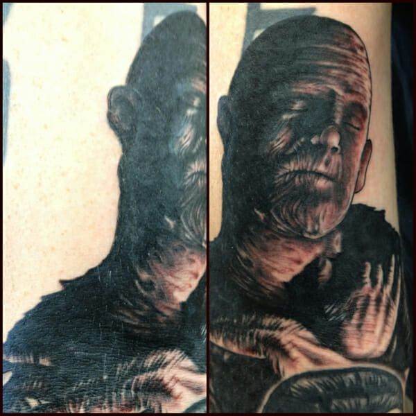 A tattoo of a man with a skeleton on his arm.