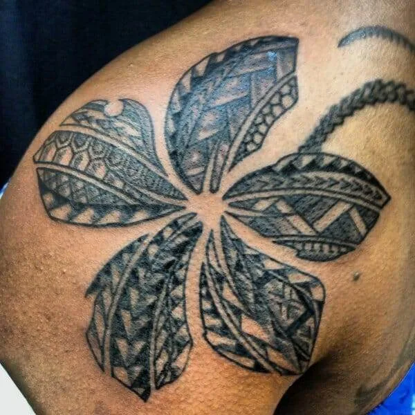 Tattoo, flower, man's shoulder.