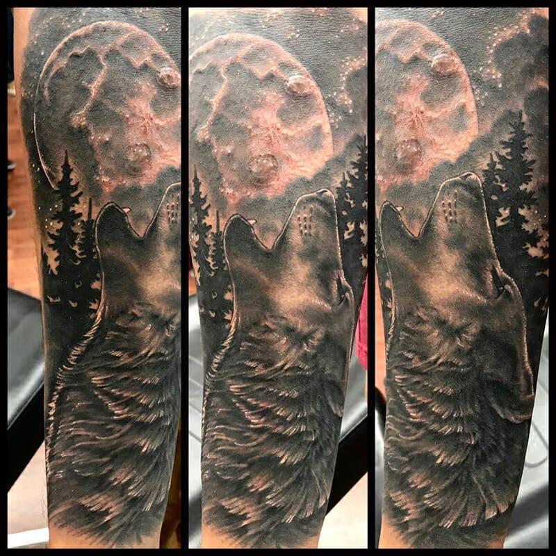 Howling wolf sleeve tattoo.