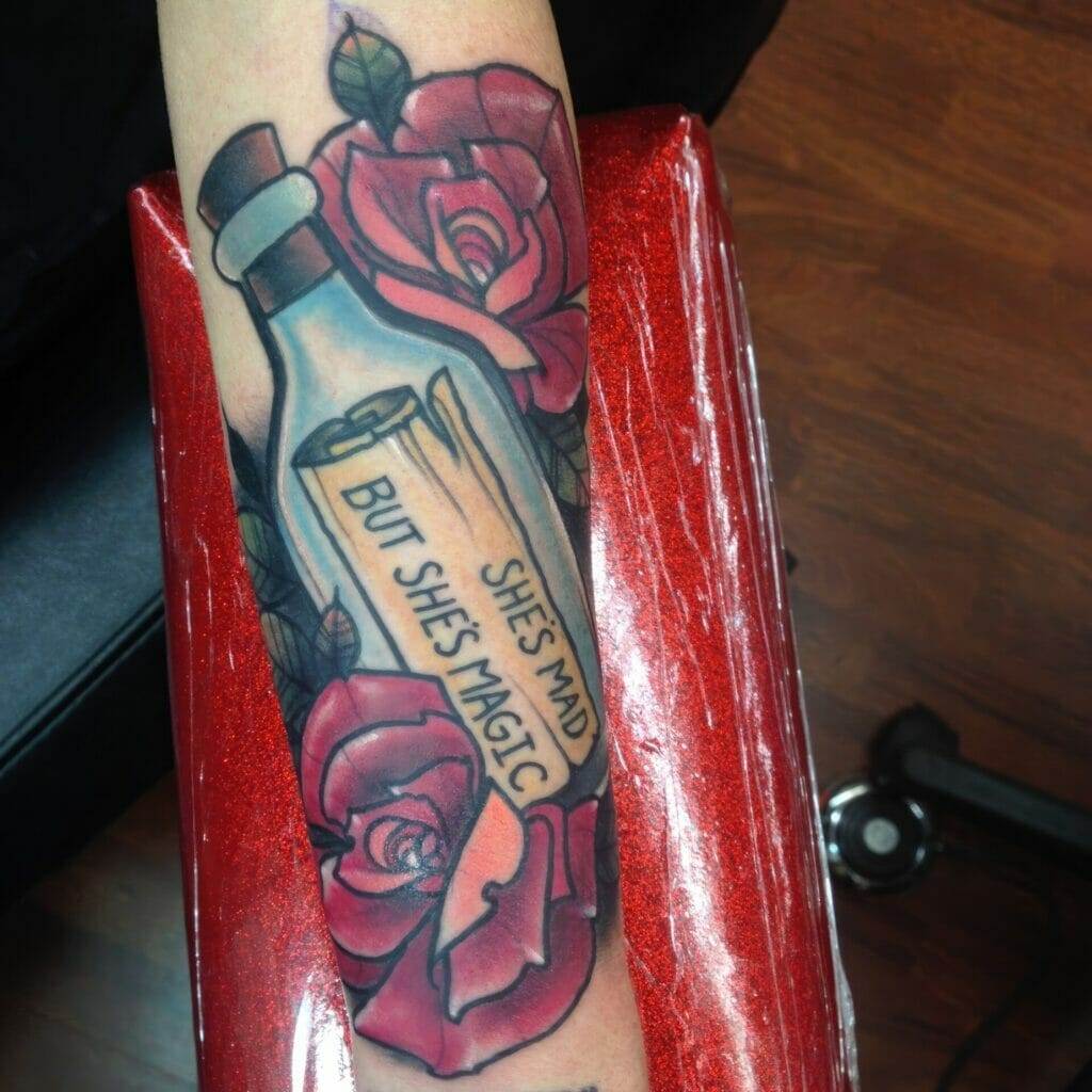 Tattoo with roses and message.