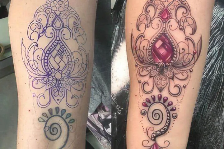 A woman's arm with two different tattoos on it.