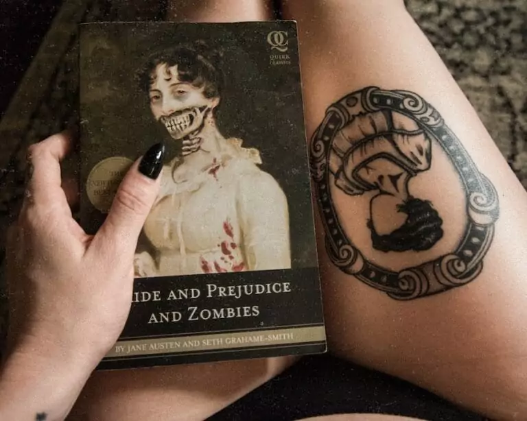 A woman holding a book with a zombie on it.
