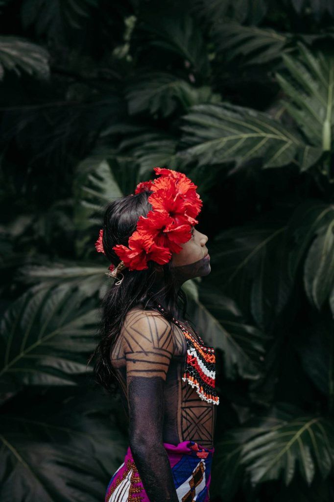 Person with Flowers Wreath and Tattoos