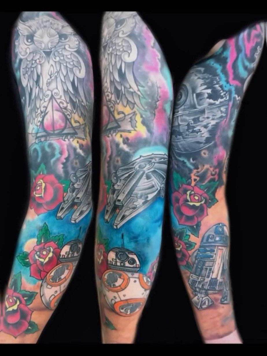 Three arms display colorful Star Wars-themed sleeve tattoos featuring characters and iconic elements from the series, including spaceships, droids, and roses with wings.