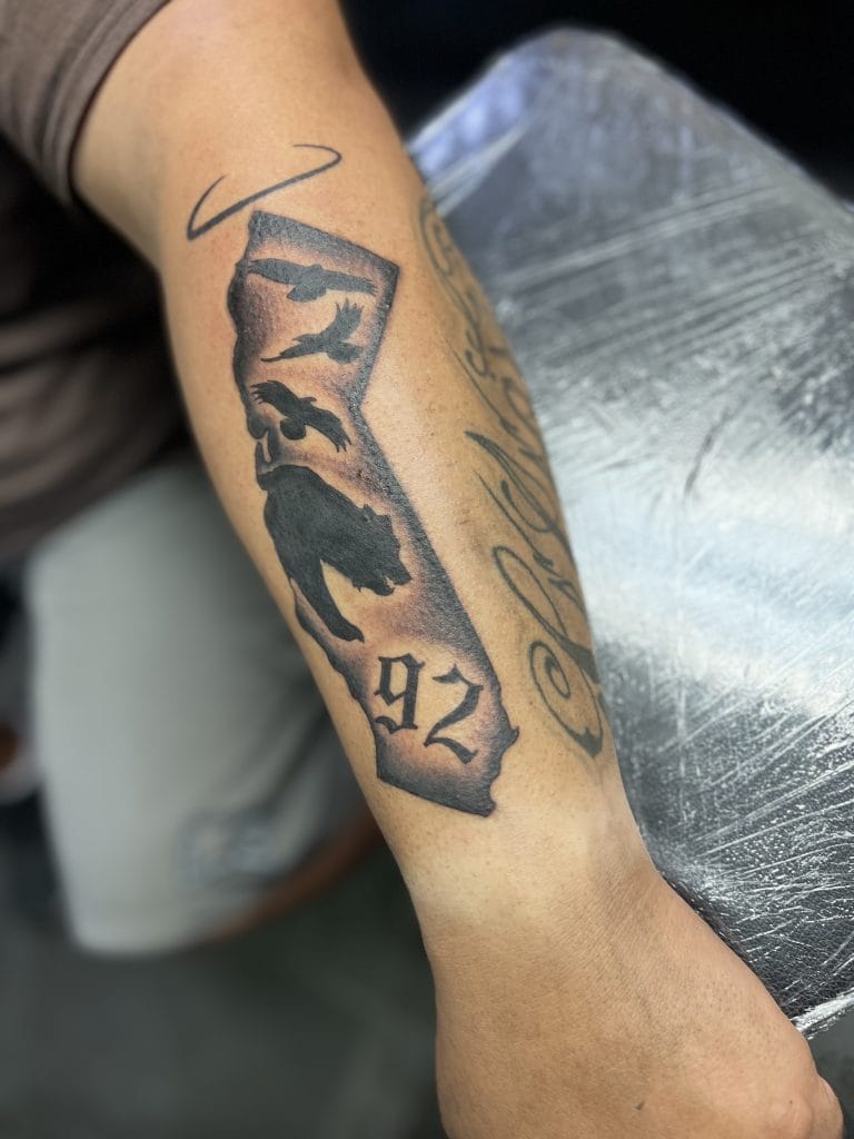 State of Nevada outline with a wolf silhouette, 92 below, and a bird flying above.