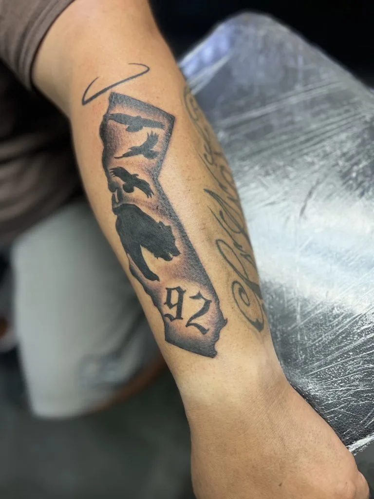 State of Nevada outline with a wolf silhouette, 92 below, and a bird flying above.