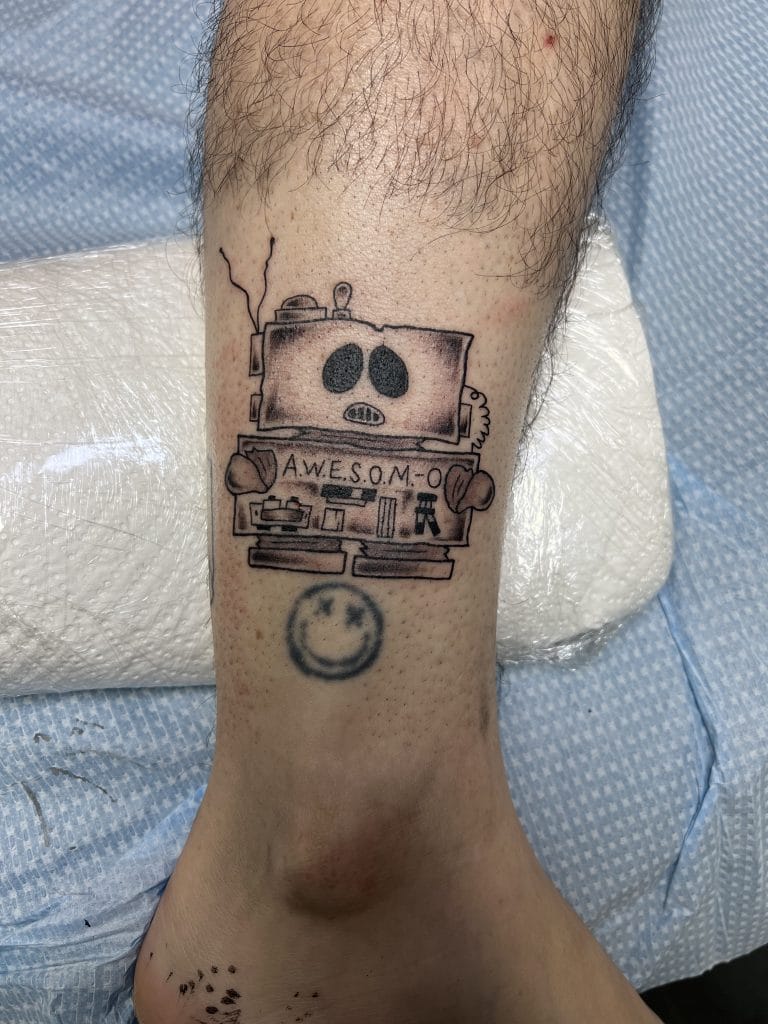 Cartoon robot with A.W.E.S.O.M.-O on its chest and a smiling face below.