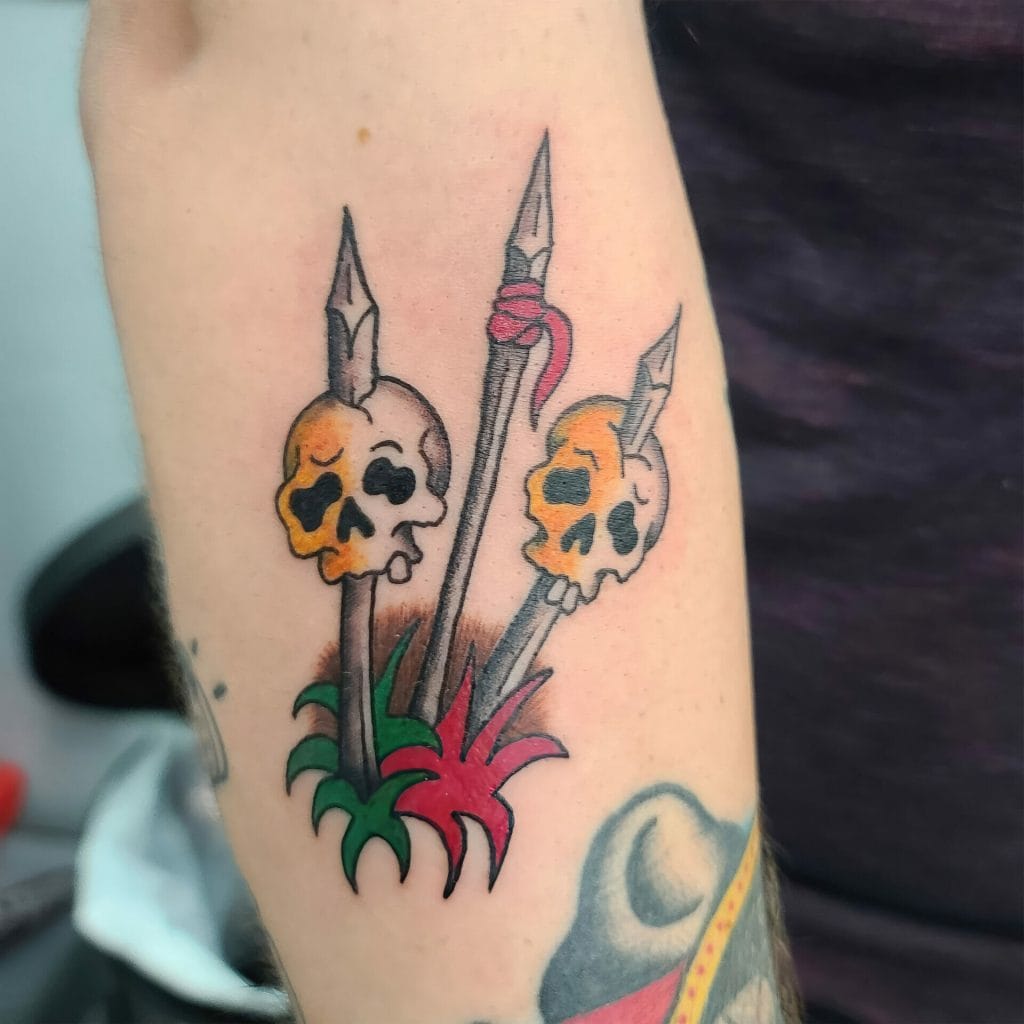 Three skulls with swords piercing through them, surrounded by red and green foliage.