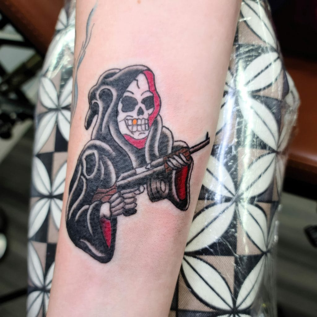 Skull-faced figure with dreadlocks holding a rifle, wearing a hoodie with red accents.