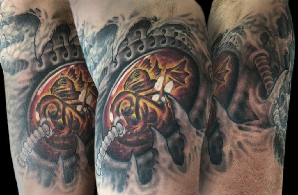 Colorful tattoo of a chameleon with lightning bolts on a persons arm.