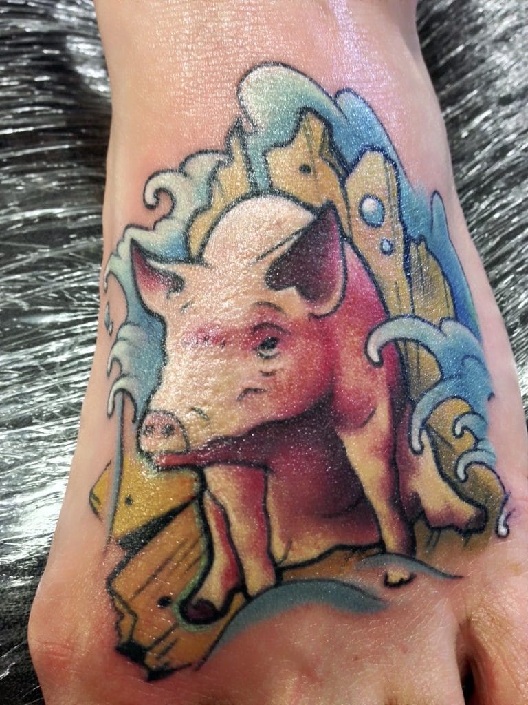 Colorful tattoo of a pig with sunglasses, surrounded by waves and abstract shapes.
