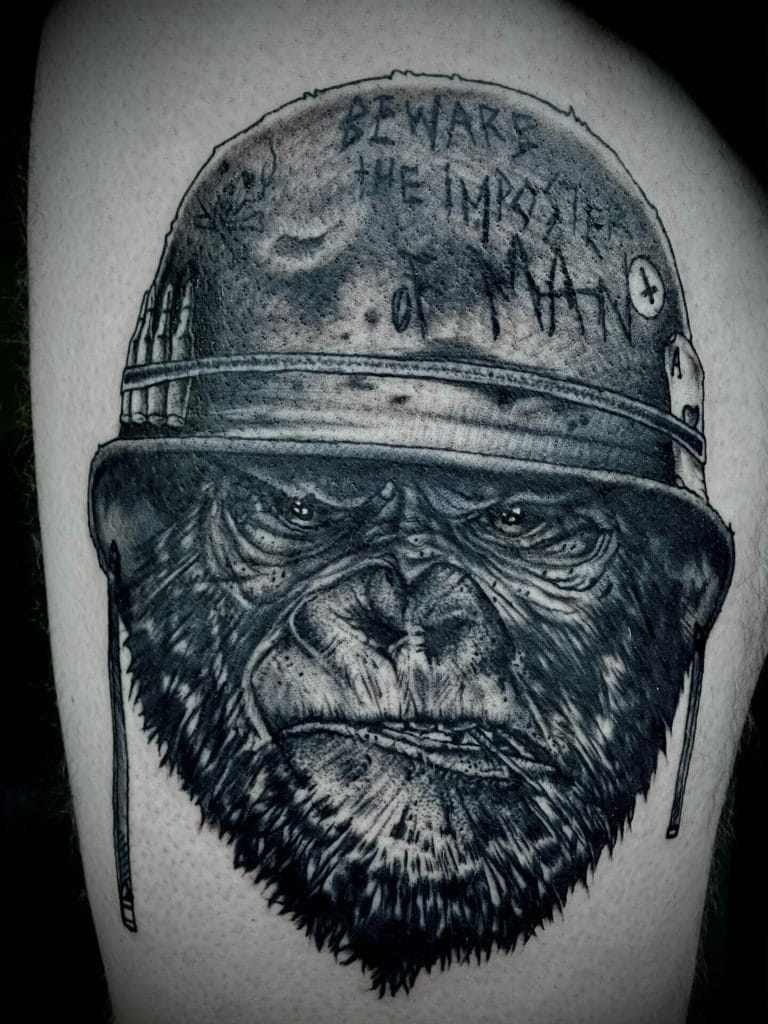 Detailed black and gray tattoo of a gorilla wearing a military helmet