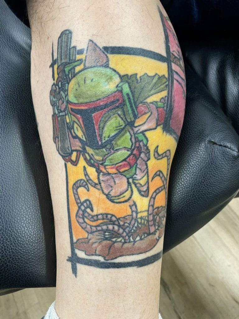 Tattoo of Baby Yoda (Grogu) wearing Mandalorian helmet, with tentacles below, on arm.