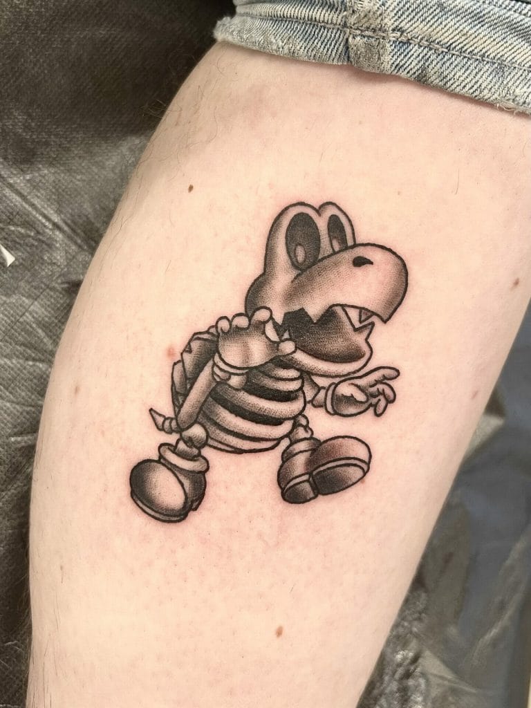 Yoshi with a backpack, pointing forward, in a black and gray tattoo style.